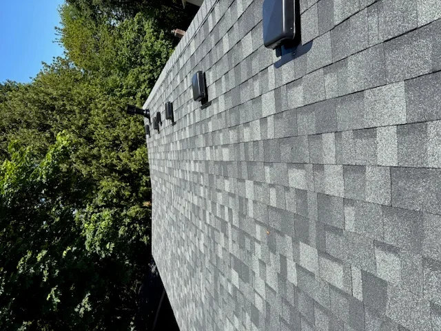 Gray architectural shingles installed on pitched roof by Kenai Construction in Portland OR